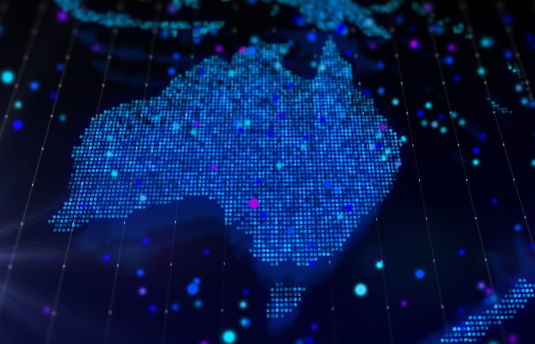 3D rendering digital map of Australia in the form of a bright glowing particle composition.